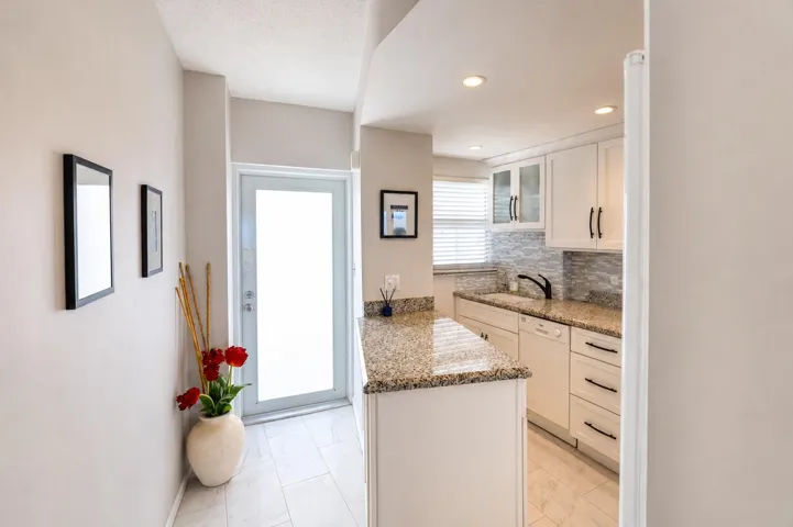 Front door and kitchen.