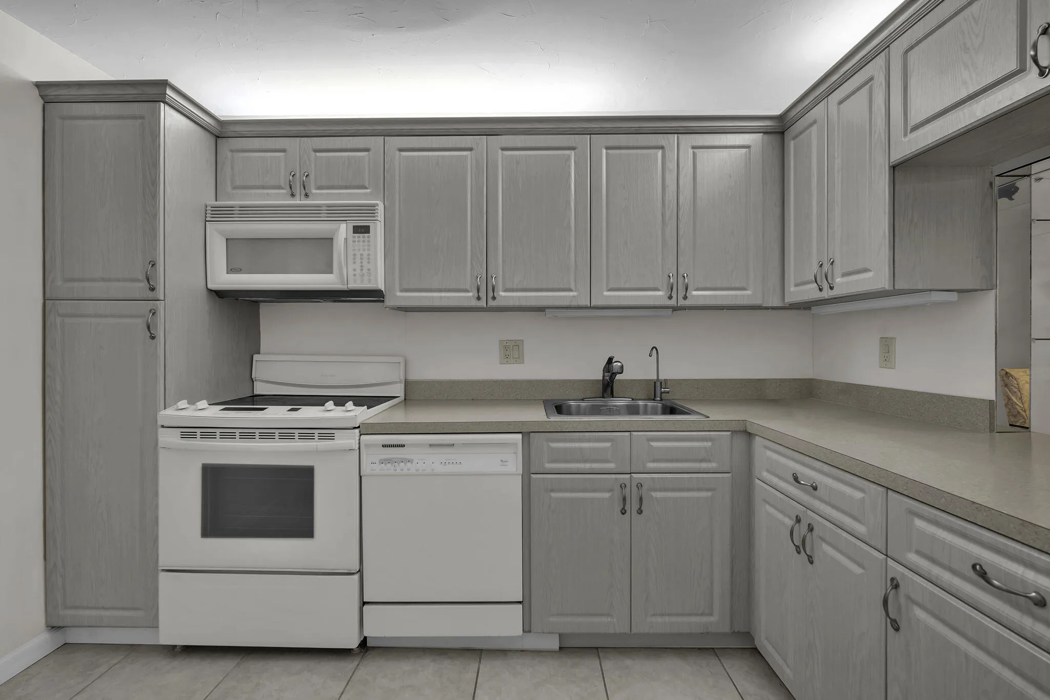 Pantry, built in microwave, dishwasher, range