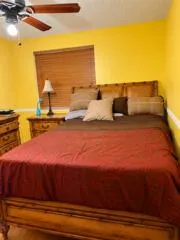 Wood-finish flooring with a coordinating wood bed frame