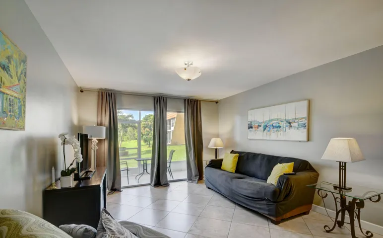 Neutral wall tones and tiled flooring enhance the living space