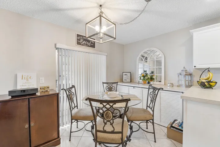 Open Kitchen with sliders to porch , plenty of storage closets extended island.