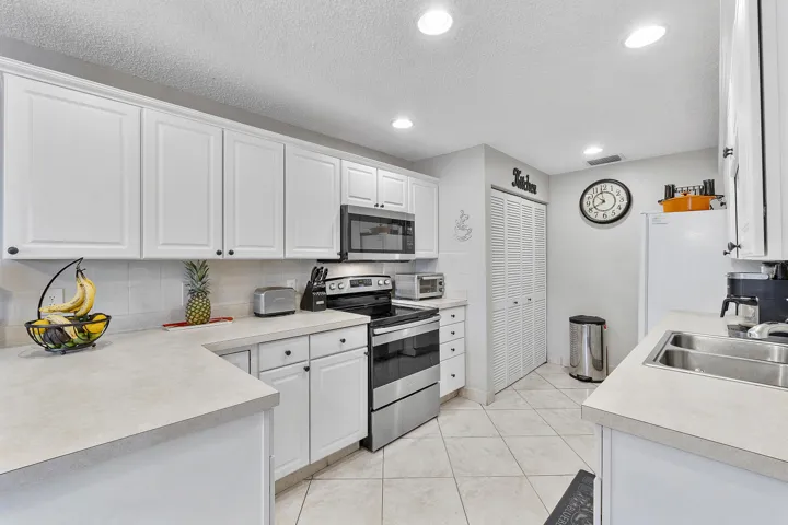 Kitchen with Washer & Dryer, newer stove, microwave