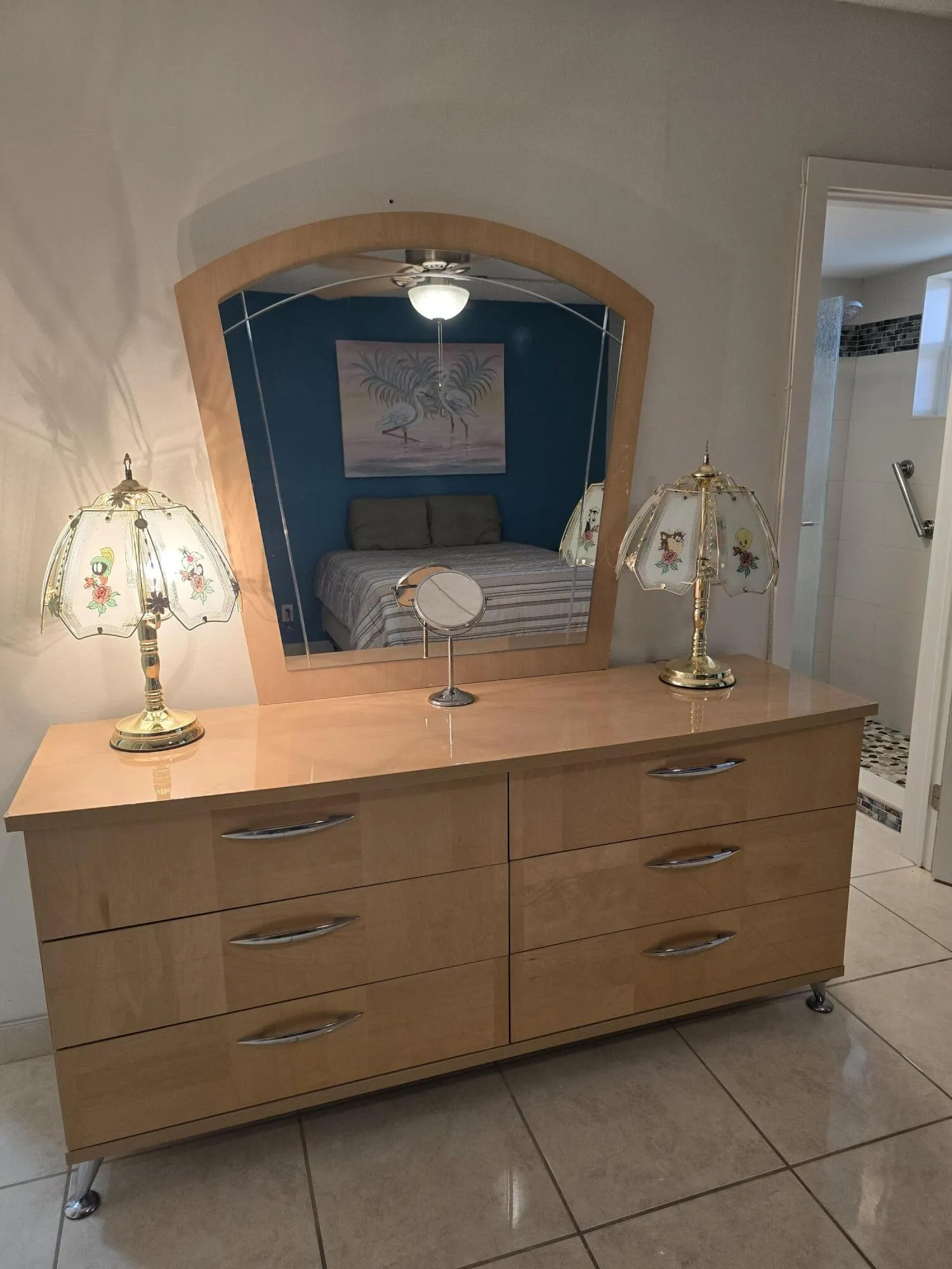 The dresser, mirror, and lamps do not convey.