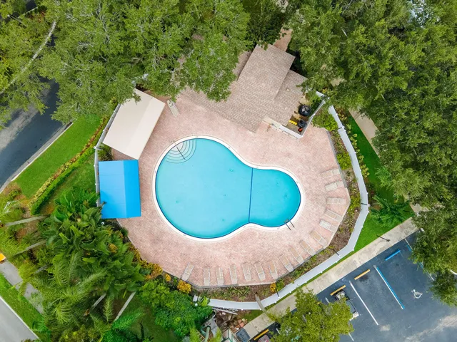 Kidney shaped swimming pool with cabana