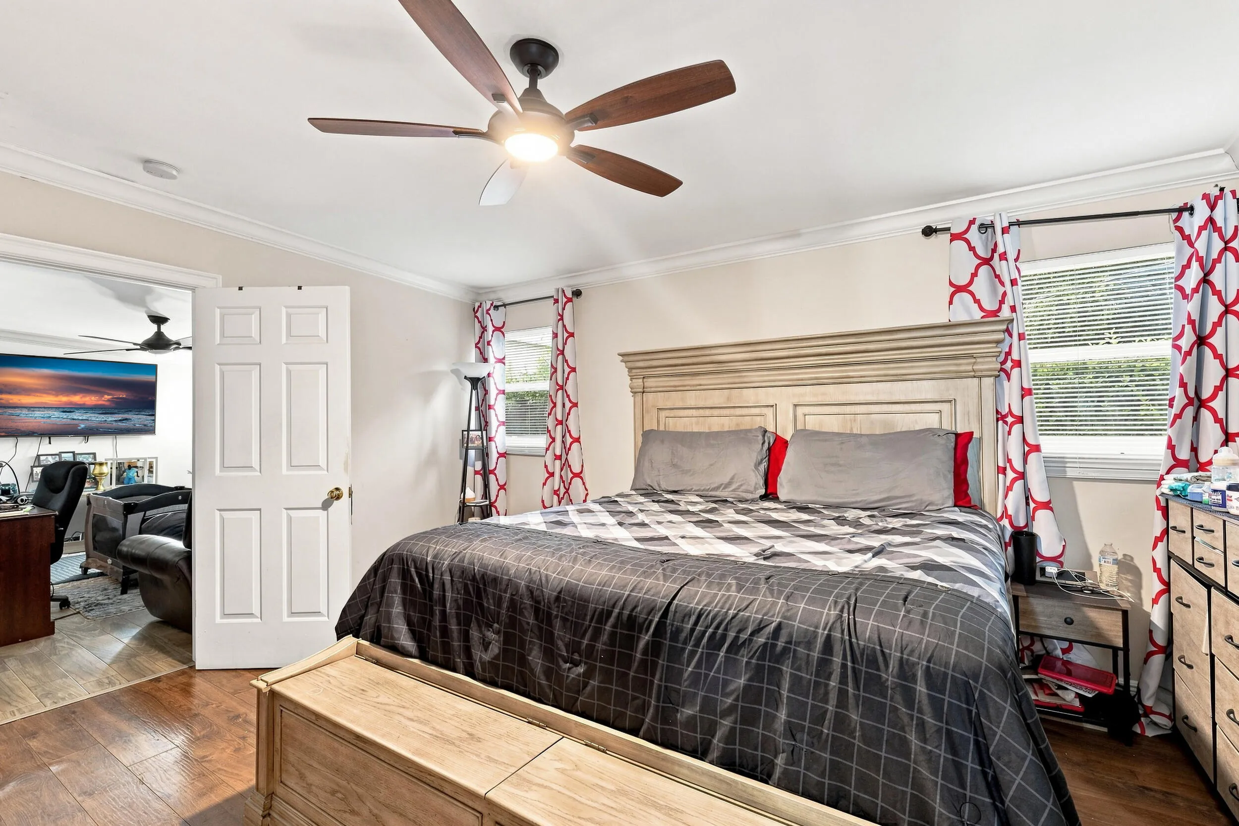 Additional bedroom view showcasing the generous room size and neutral finishes.
