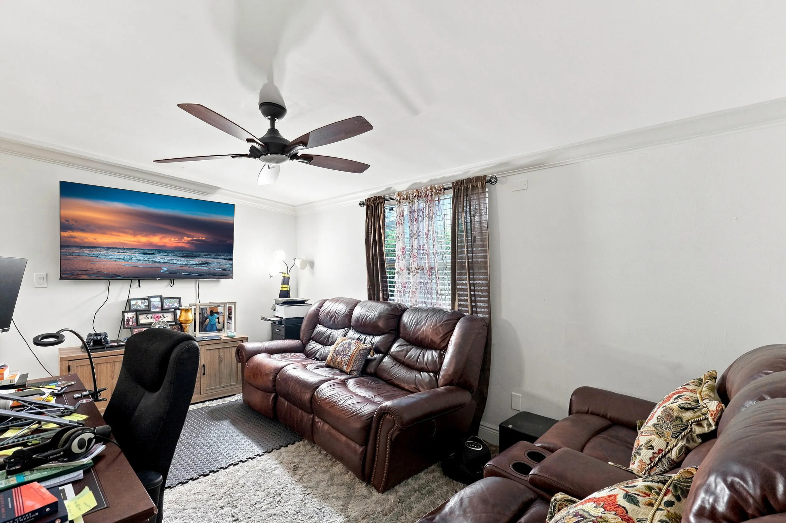 Additional living room view highlighting the spacious layout and neutral finishes.