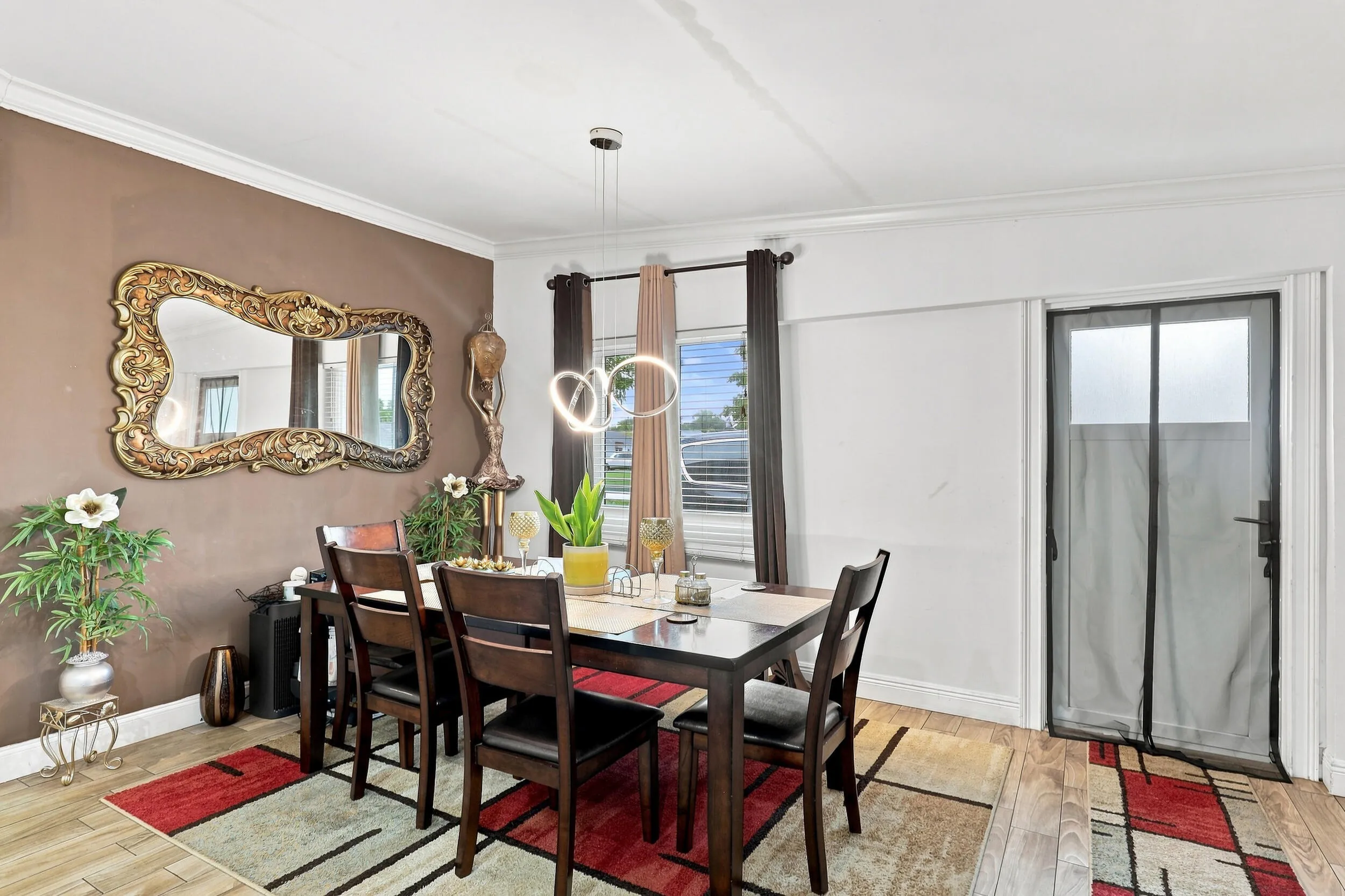 Additional dining view highlighting the natural light and flexible open layout.