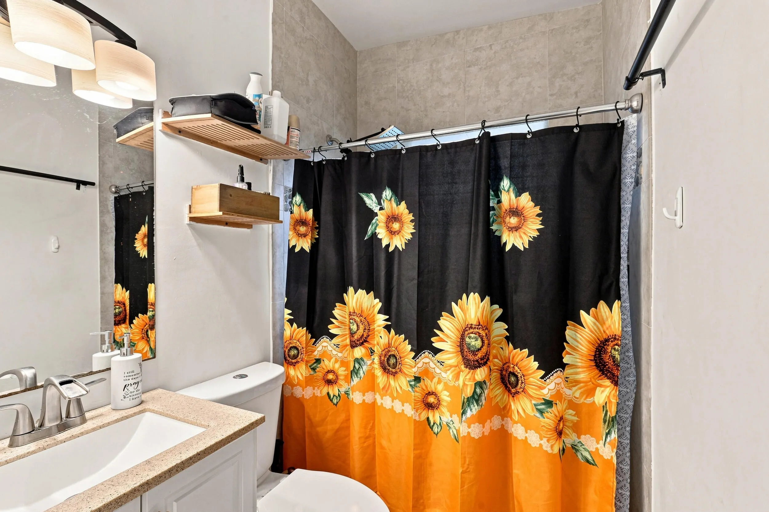Additional bathroom view highlighting the vanity and tub/shower area.