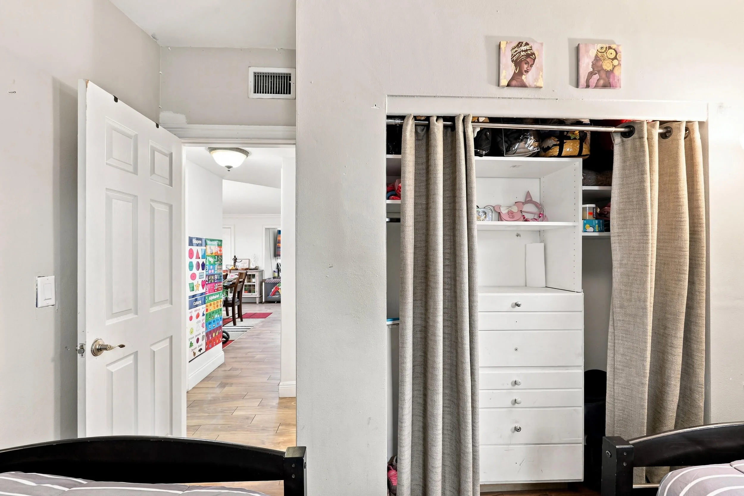Additional bedroom view highlighting the closet and storage space.
