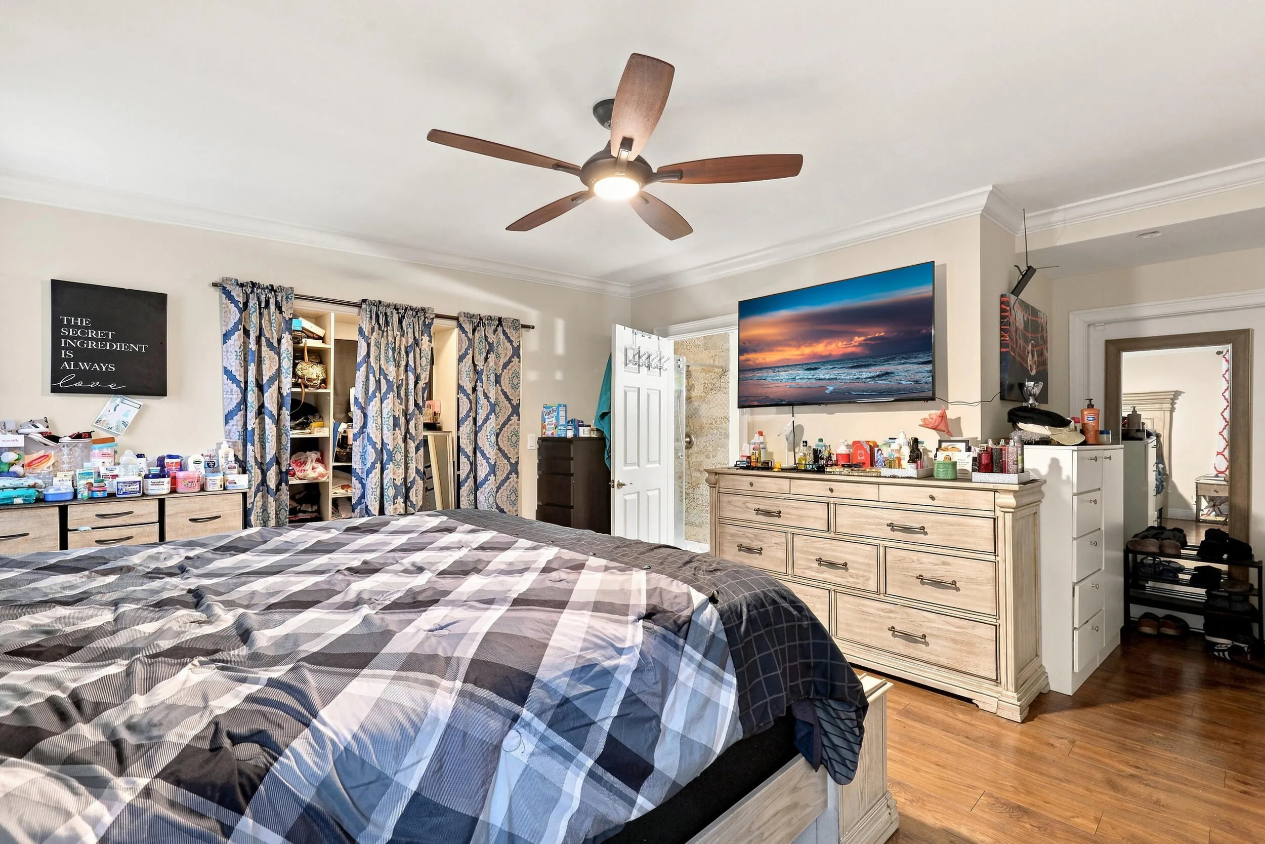 Additional view of the primary bedroom highlighting the spacious layout and storage.