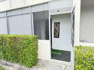 The screen porch has a door for access to outside.