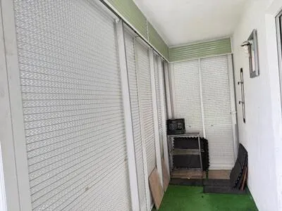 The screen porch has partial, roll down hurricane shutters.