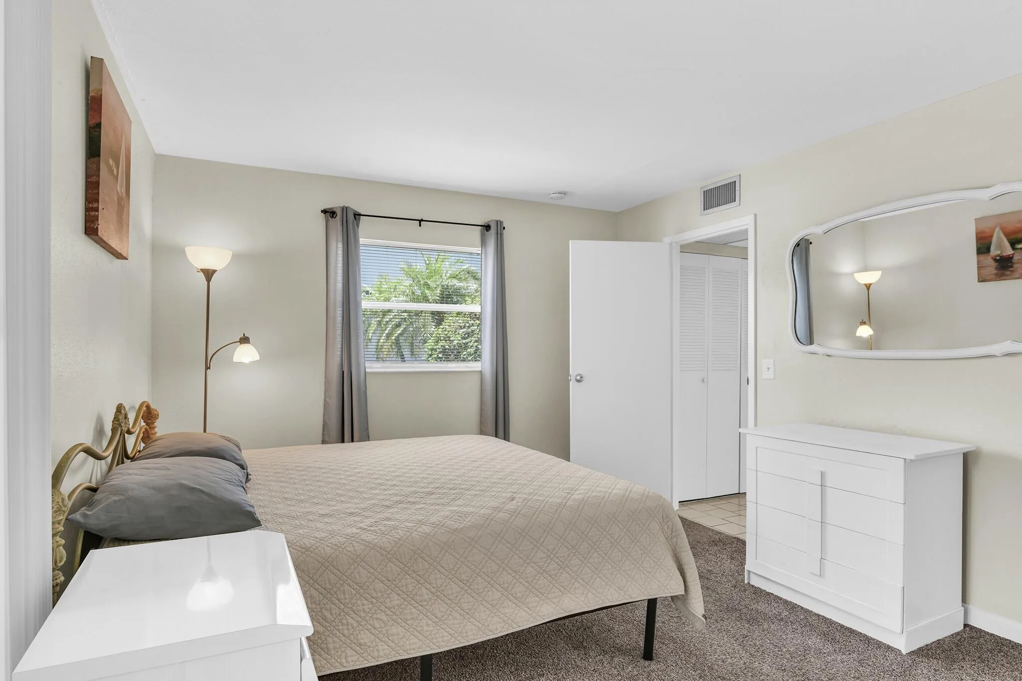 Bedroom featuring neutral-toned walls and carpet flooring