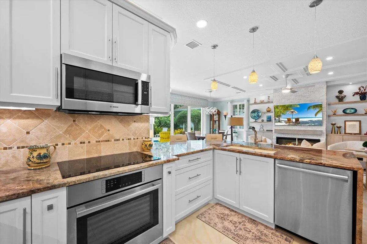 Completely customized kitchen, adding counter space, high end pull out drawers and waterfall countertops