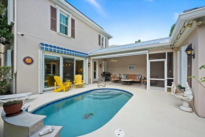 Auto awning over sliders creates additional shade and character
