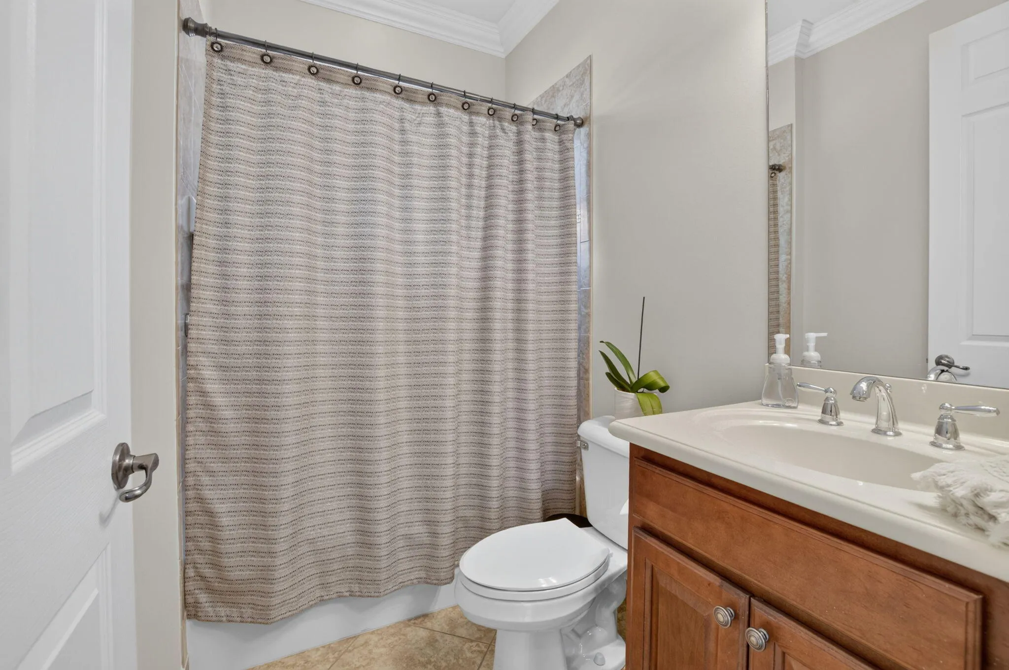 First-Floor Guest Bath with Wood Vanity