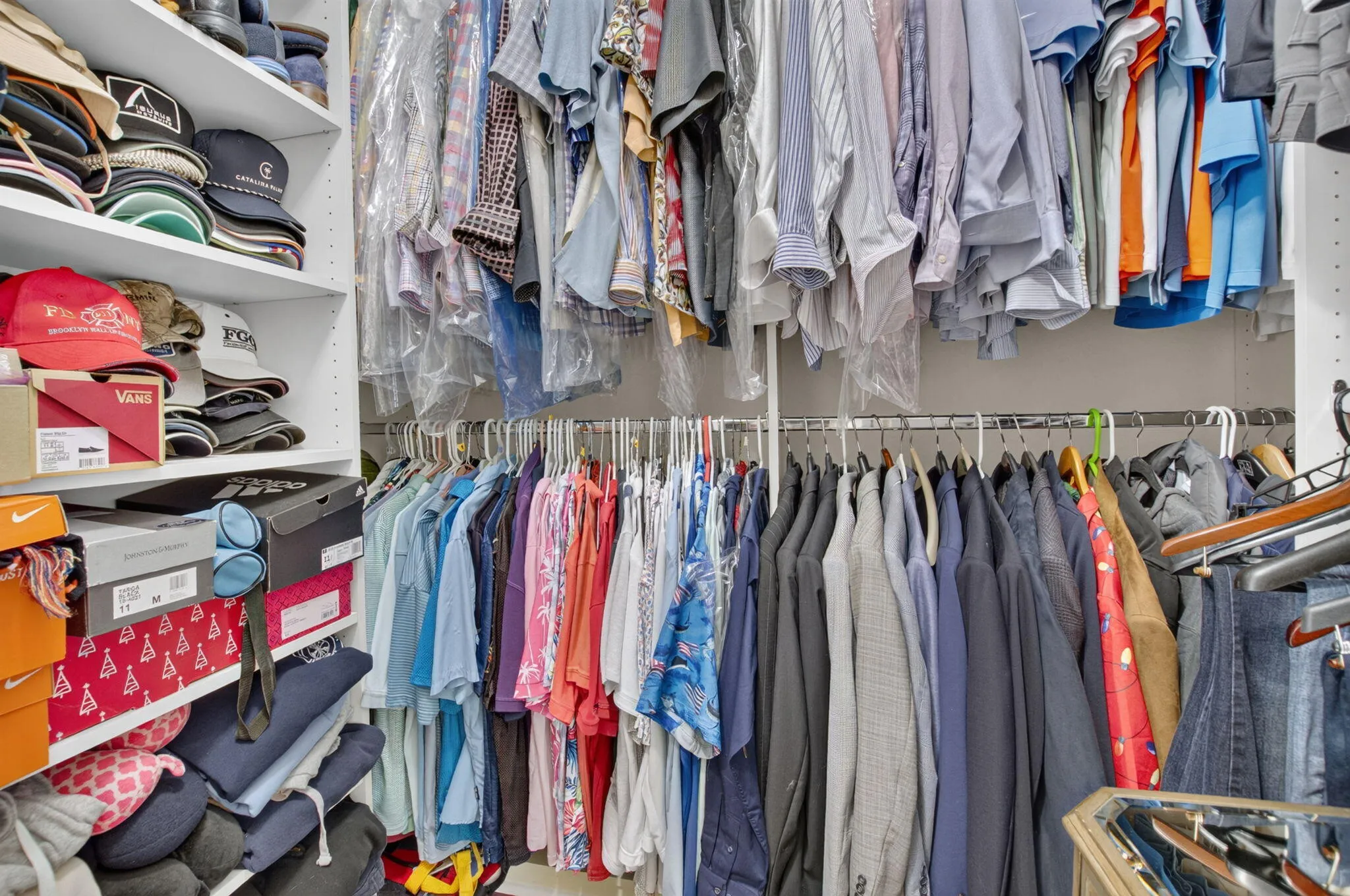 Built-Out Walk-In Closet with Shoe Shelving