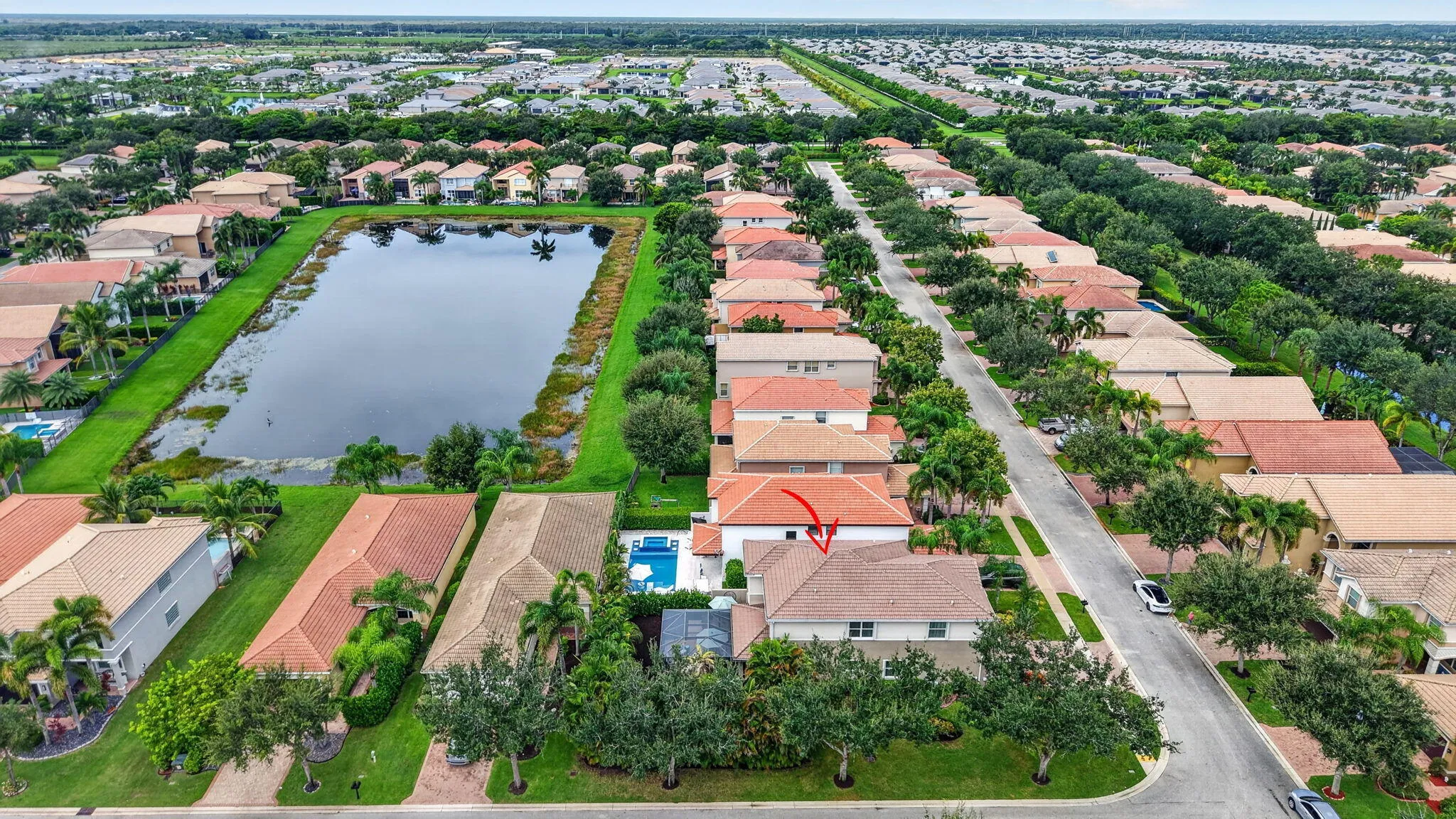 Aerial | Lake and Green Space Down the Block