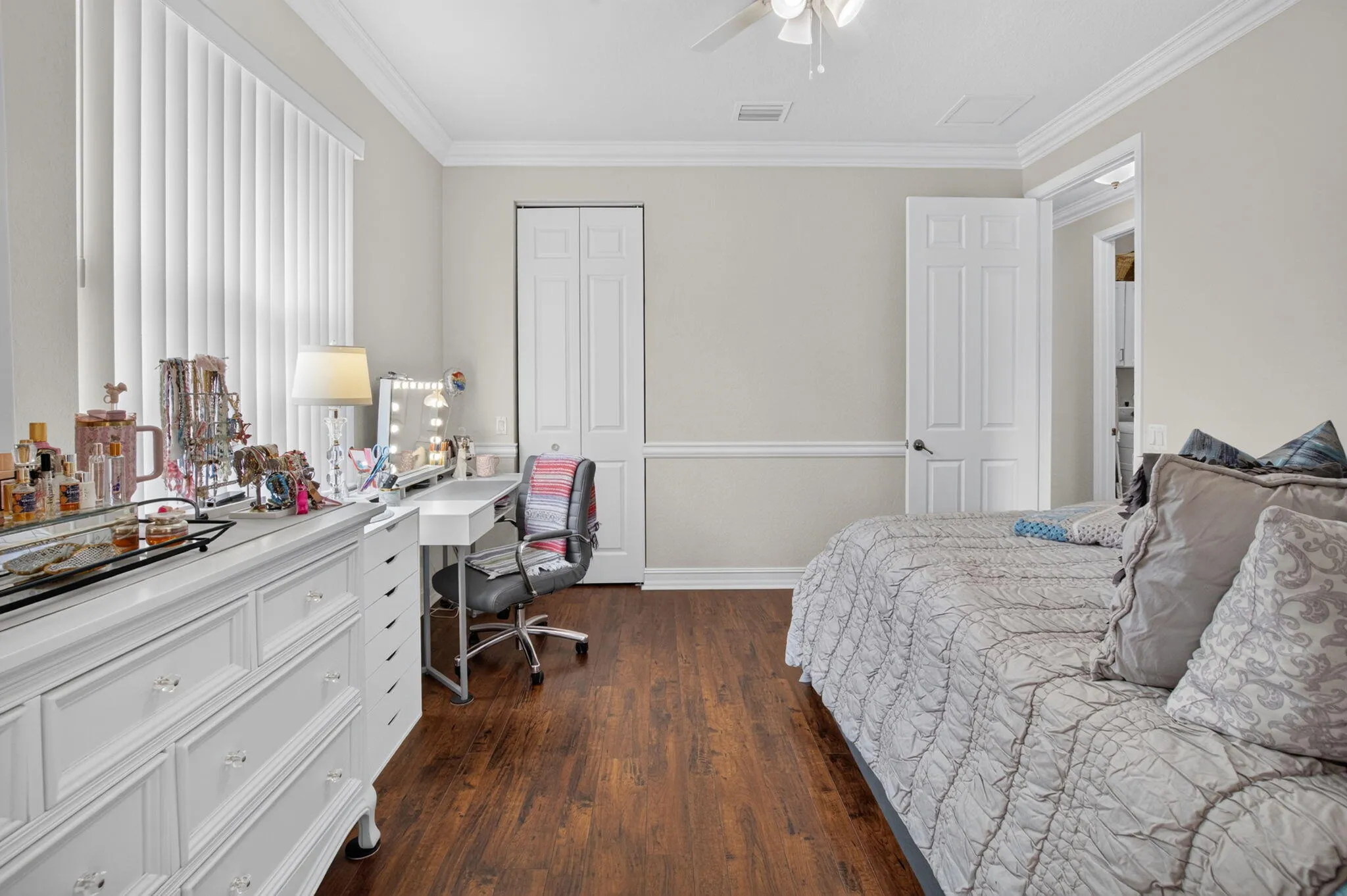 Bedroom with Built-In Vanity & Wood Floors