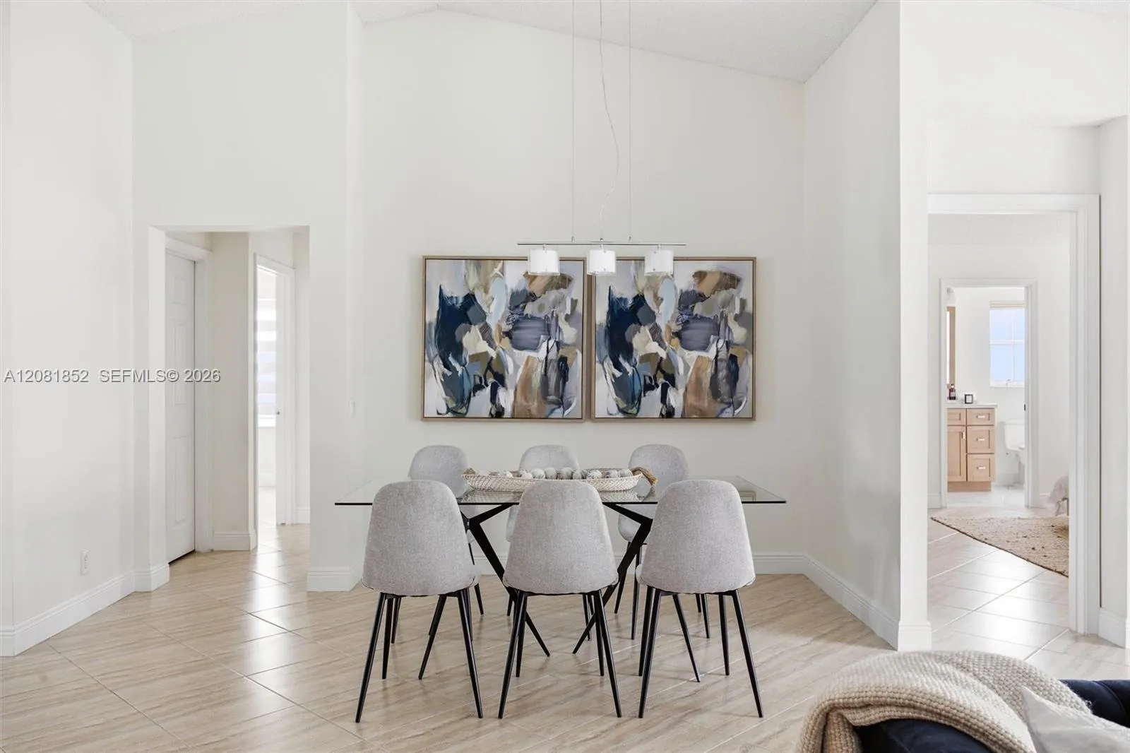 Sophisticated dining space with designer artwork and stylish seating.