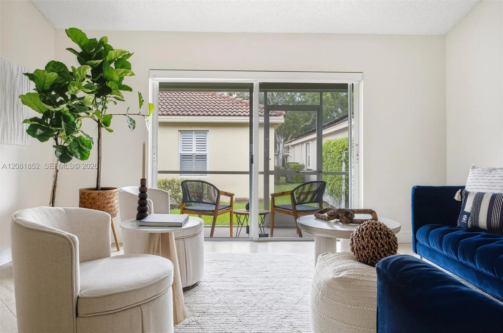 Stylishly staged living area featuring designer accents and abundant natural light.