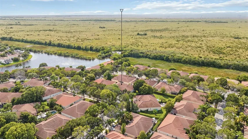 Aerial perspective highlighting the tranquil nature preserve bordering the community.