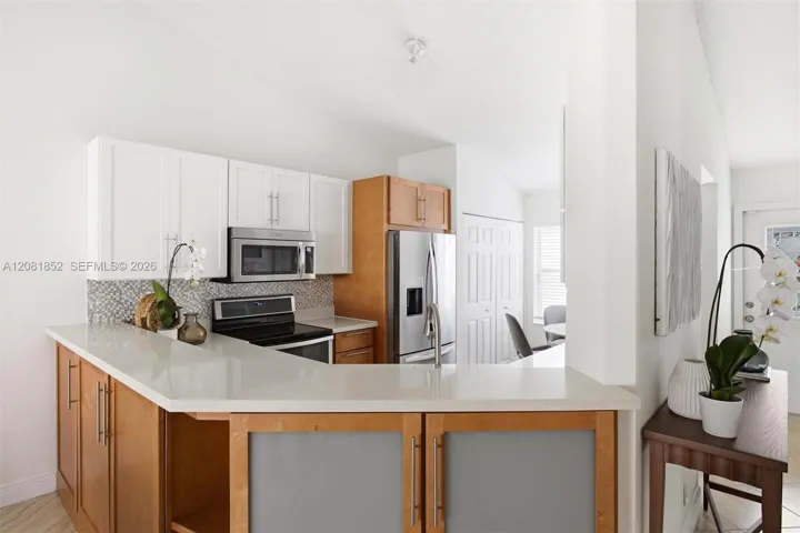 Well-appointed kitchen with expansive island, perfect for casual dining.