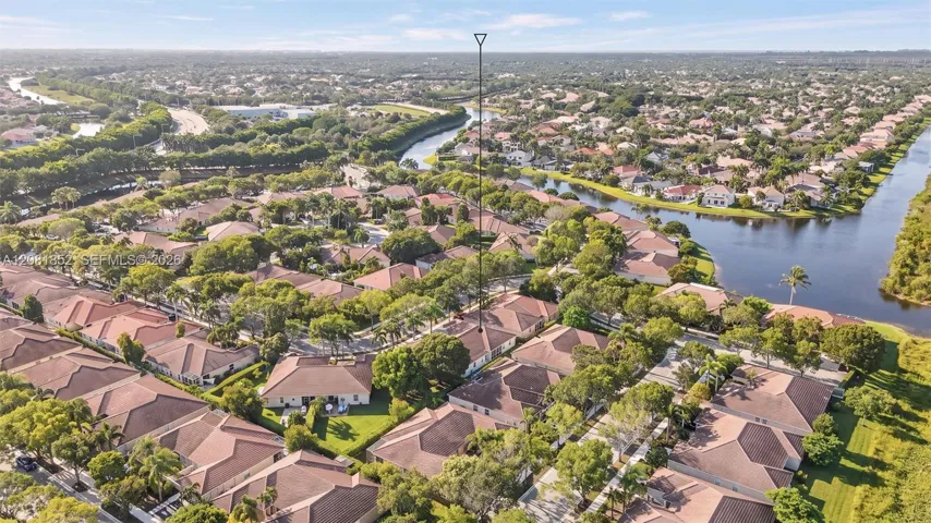 Aerial view capturing peaceful waterway views throughout the neighborhood.