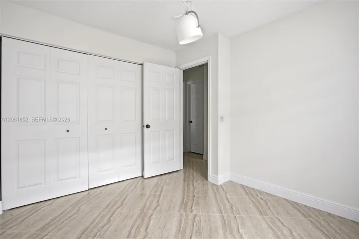 Well-appointed guest bathroom with convenient linen storage.