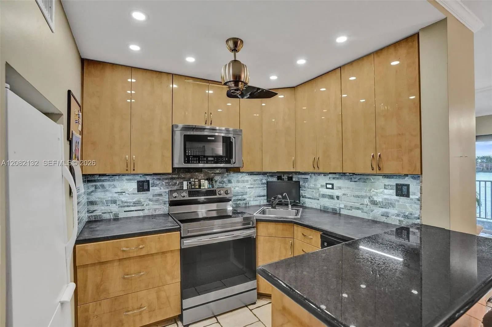 This kitchen PACKS a PUNCH with an efficent layout, lots of counter space, a HUG pantry and a CRAZY amount of storage!