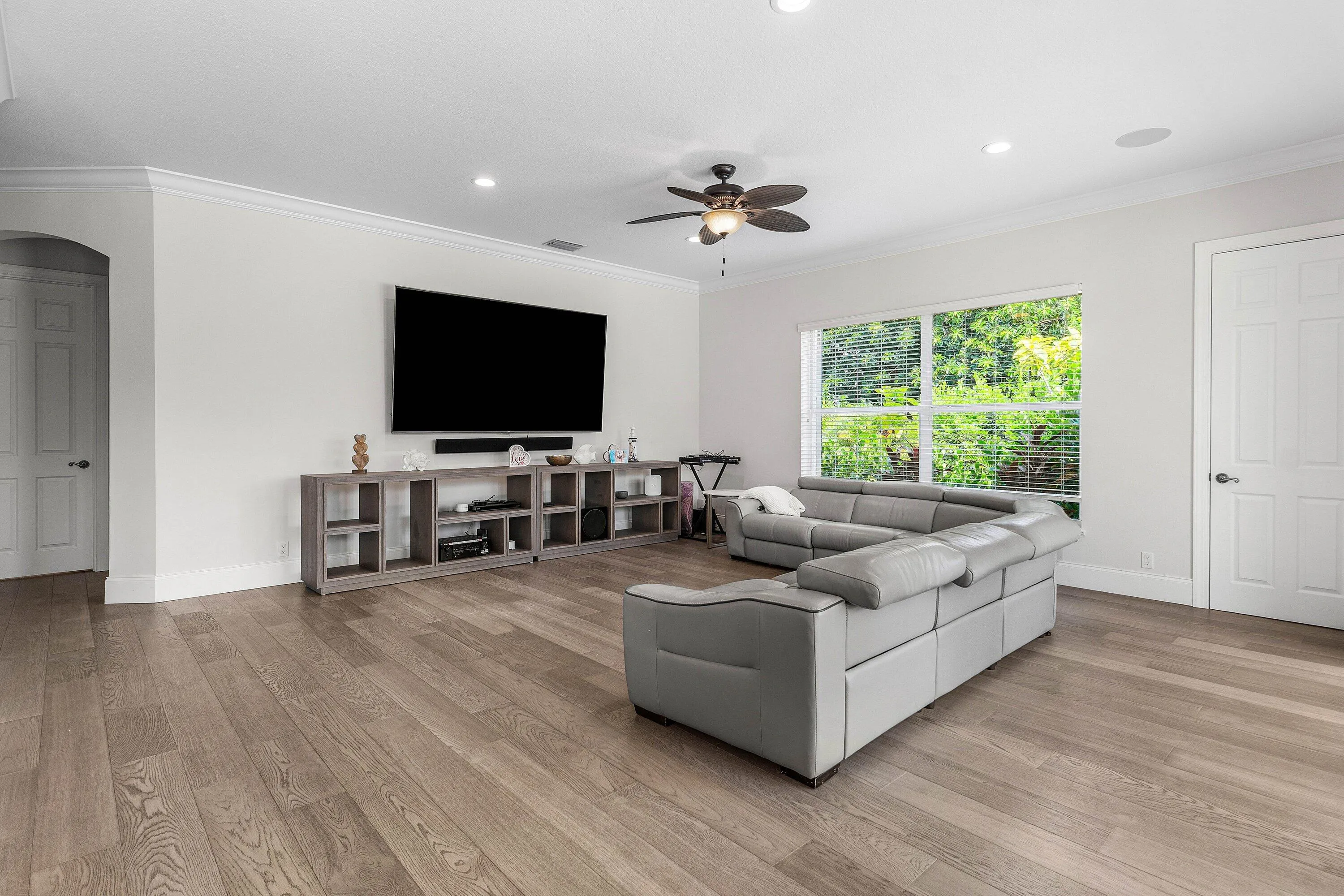 Large Family Room with access to the pool deck and a cabana bath