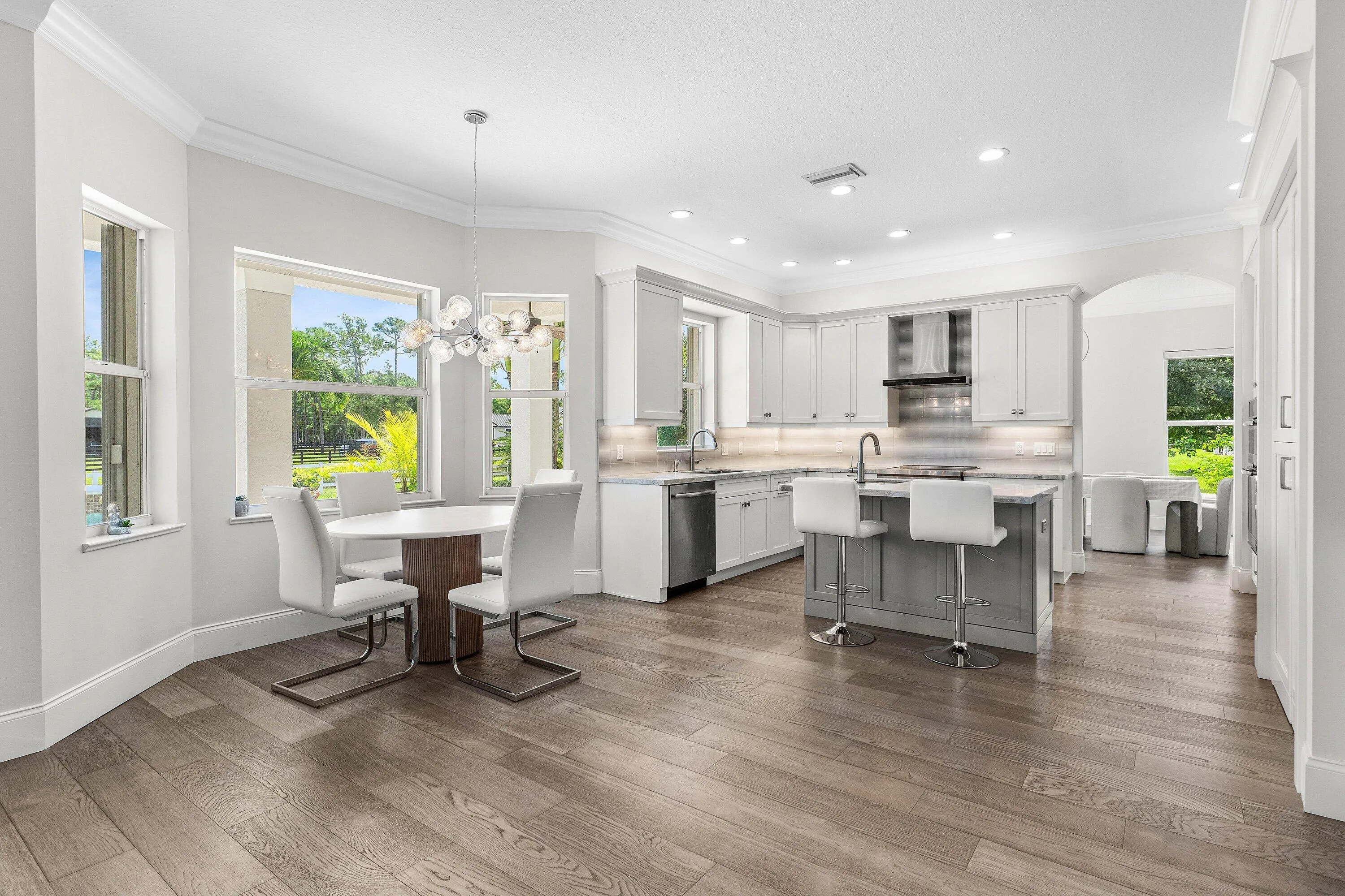 Gourmet Kitchen with marble countertops and lots of workspace to enjoy cooking.