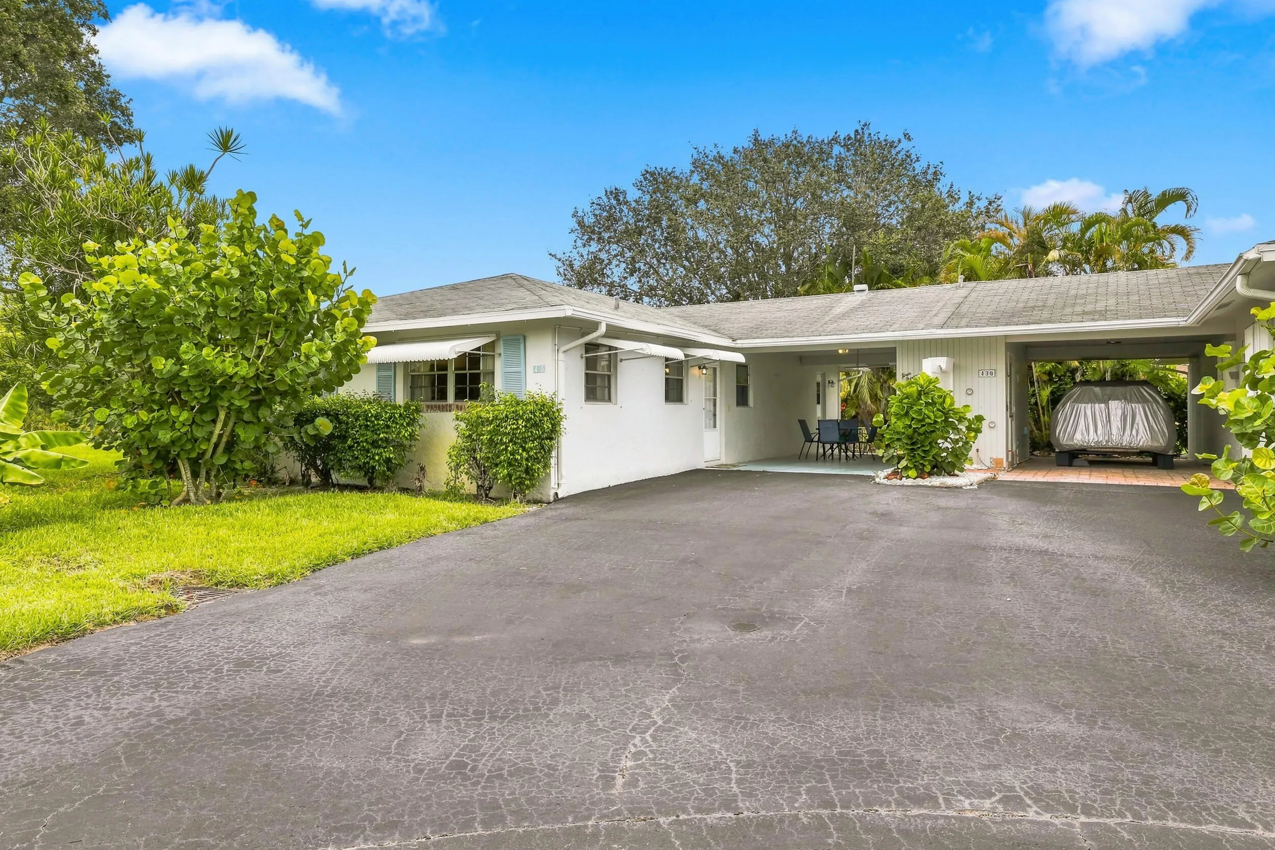 Corner unit with large driveway and covered parking. Country Manors Delray Beach FL
