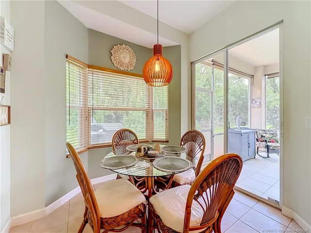 JUST OPEN THE SLIDER FROM THE KITCHEN AREA TO THE LARGE SCREENED IN PATIO, HAS A PASS THROUGH TO THE PATIO FROM THE KITCEN . YOU CAN ENTER THE LIVINGROOM FROM THE PATIO ALSO. GREAT TO ENTERTAIN