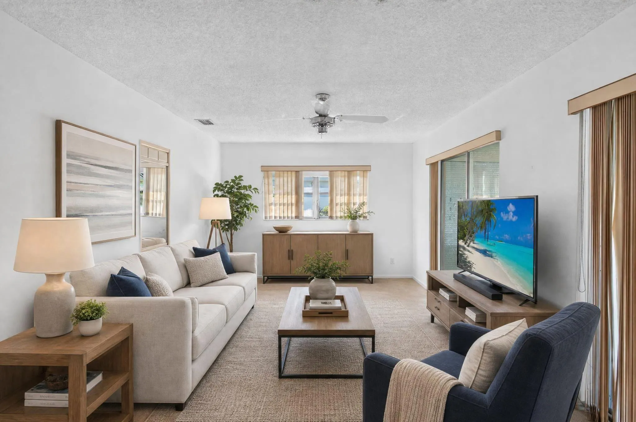 Recessed lighting, ceiling fan, sliding glass door, window treatments, and durable flooring