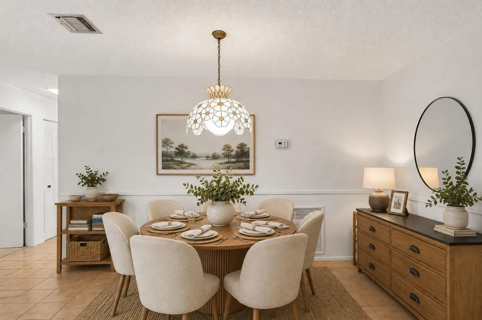 Tile flooring, wainscoting, and a decorative pendant light fixture