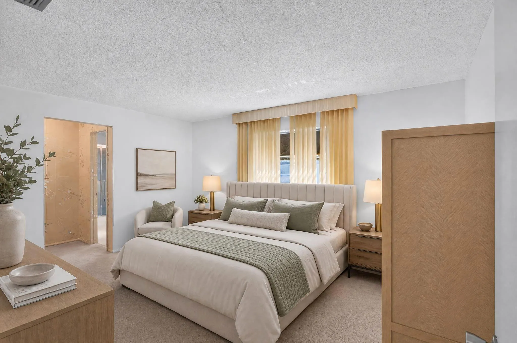 Carpeted room with a textured ceiling, a light-colored headboard, and a window with drapery