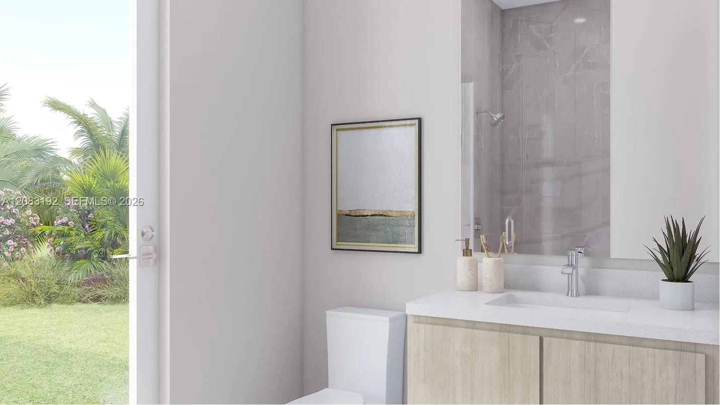 This en-suite bathroom also enjoys direct access to the backyard.