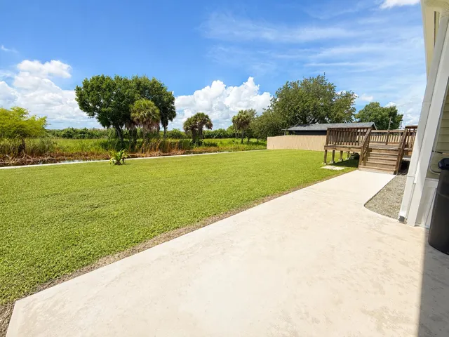 Sunny Backyard Lawn and Deck