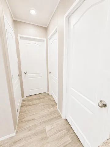 Bright Neutral Hallway with White Panele