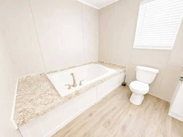 Bright Modern Bathroom with Tub and Toil
