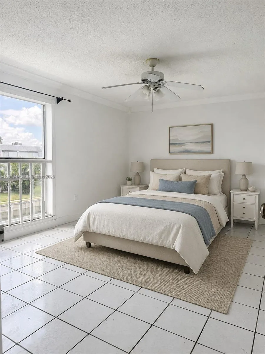 Virtually staged primary bedroom. Residence offered unfurnished.