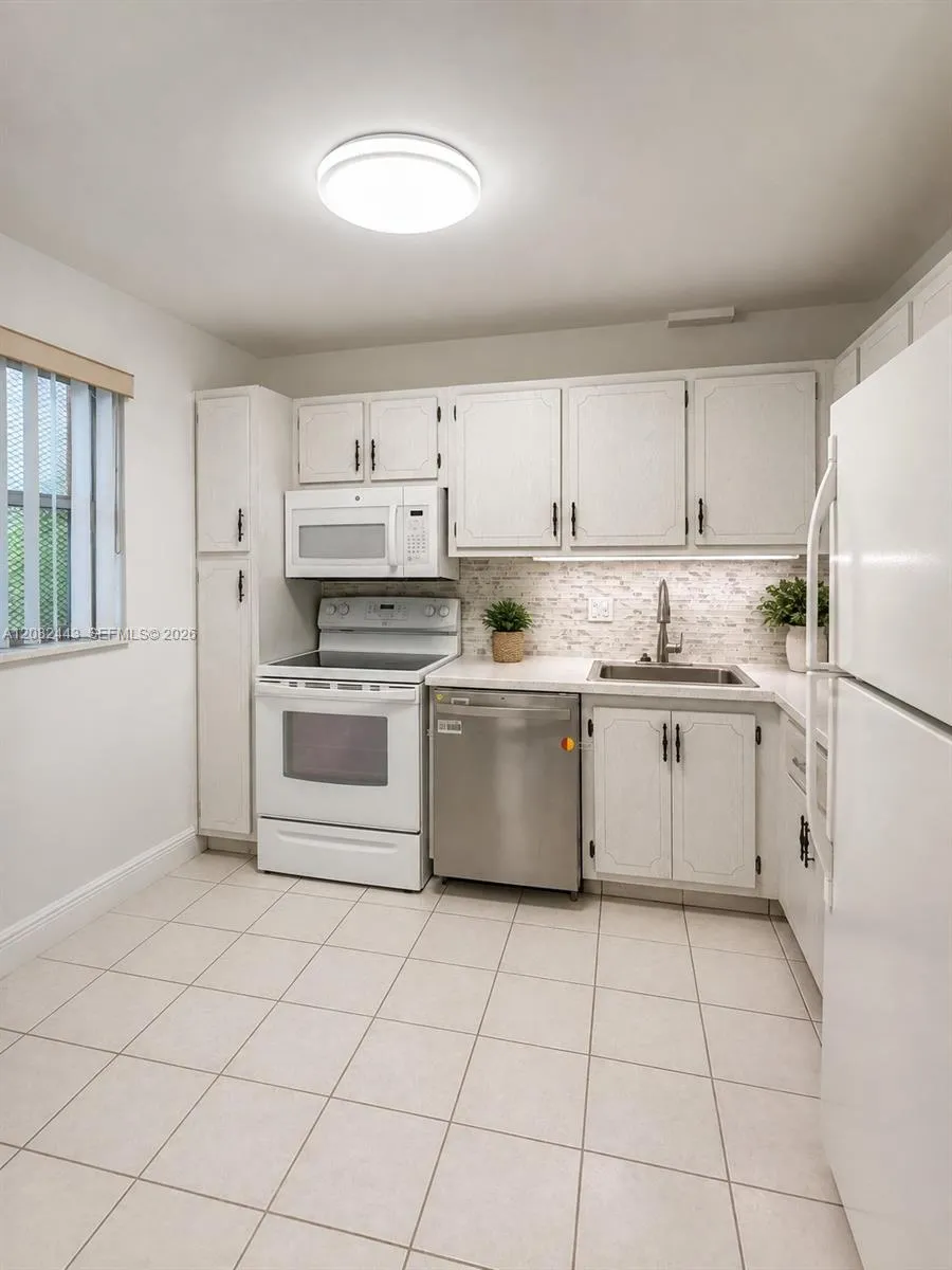 Bright kitchen with ample cabinet space.