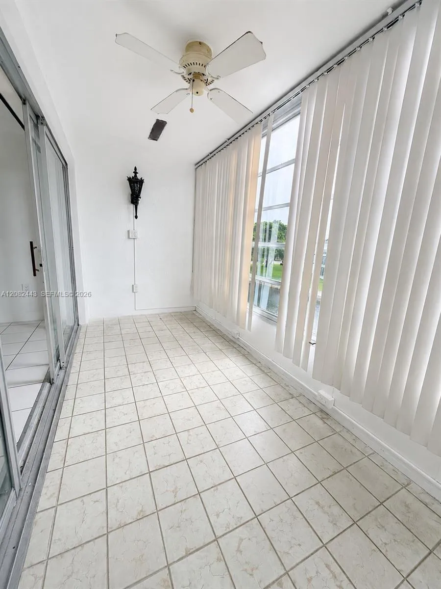 Spacious enclosed screened balcony.
