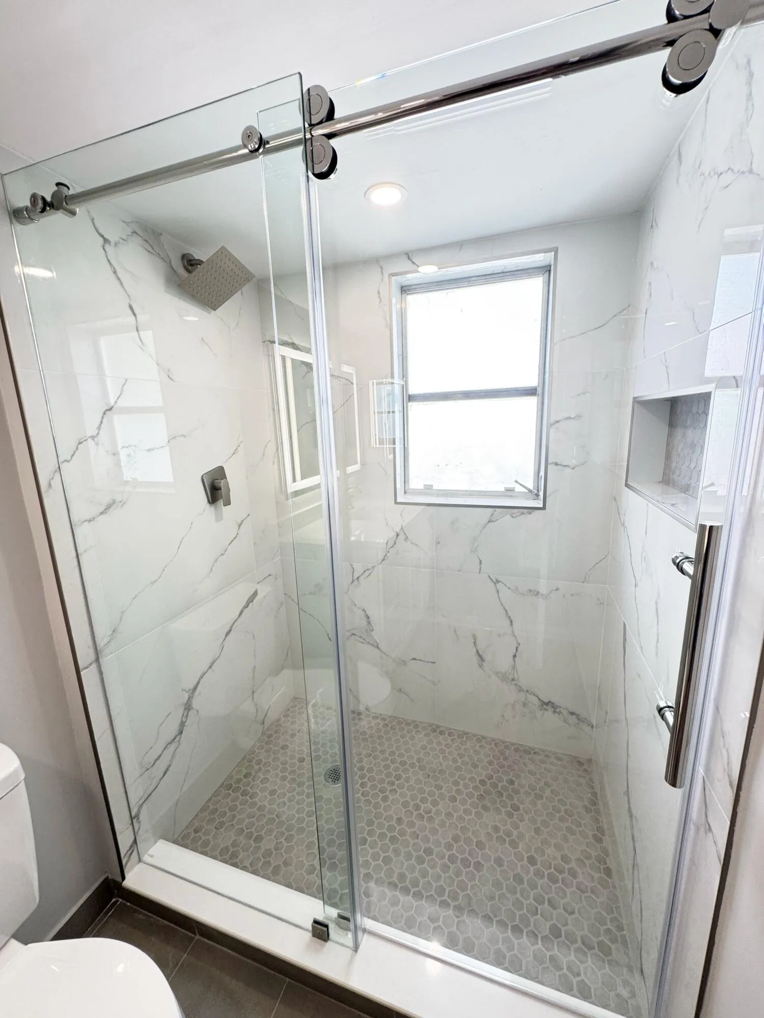 custom tile shower and tile flooring with top grade sliding door