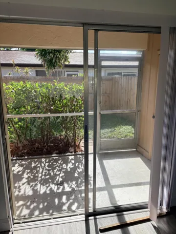 SCREENED PORCH WITH SMALL STORAGE CLOSET