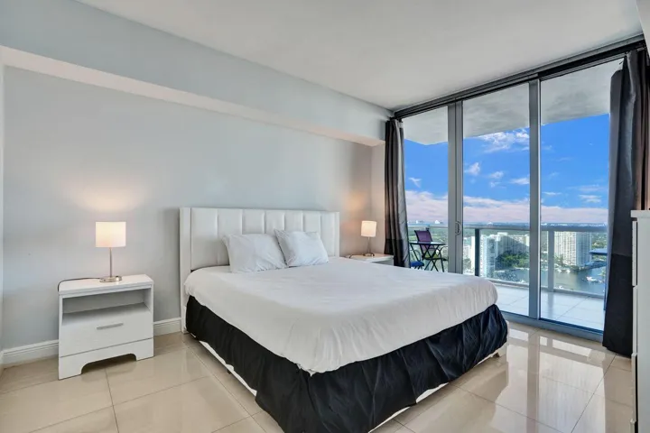 Primary bedroom with a water view