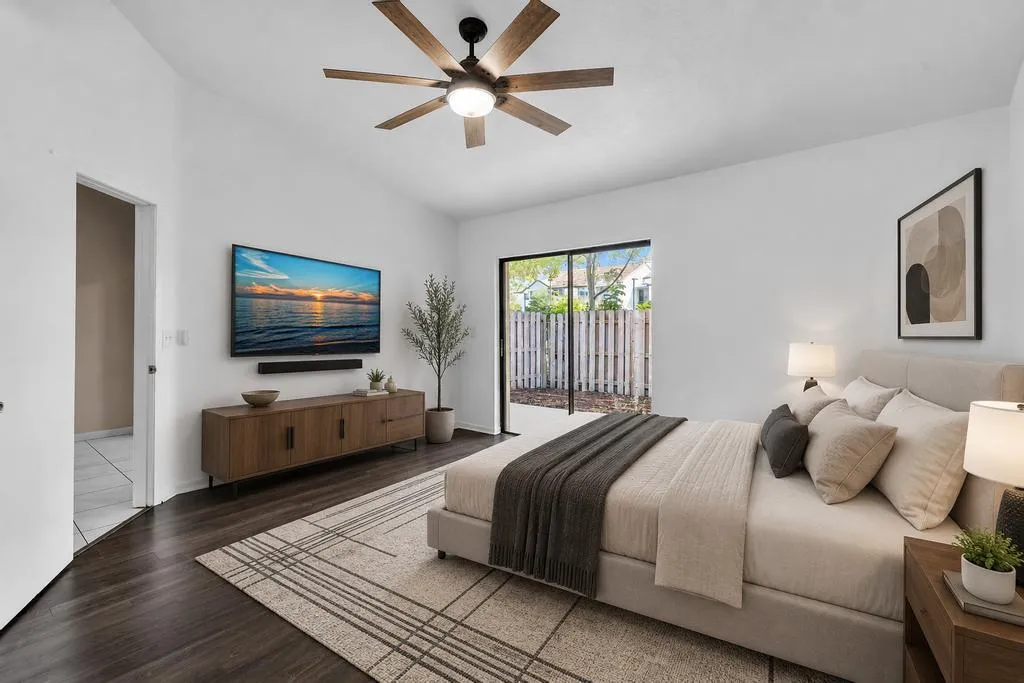 VIRTUALLY STAGED - PRIMARY BEDROOM WITH VAULTED CEILINGS