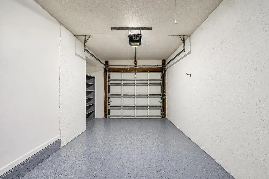 FRESHLY PAINTED GARAGE WITH EPOXY FLOOR