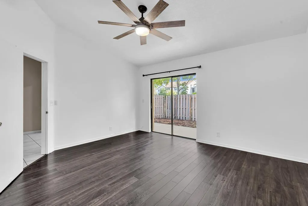 PRIMARY BEDROOM WITH VAULTED CEILINGS